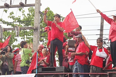 On one side of the road are red shirt supporters…
